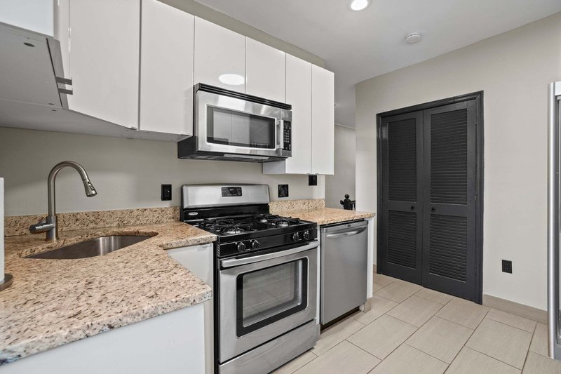 Full kitchen — granite counters and stainless appliances