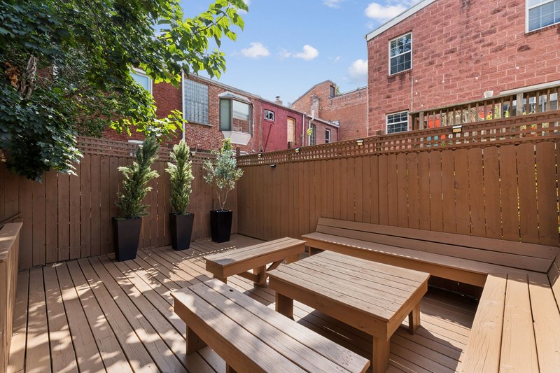 Private patio and side yard — rare in DC