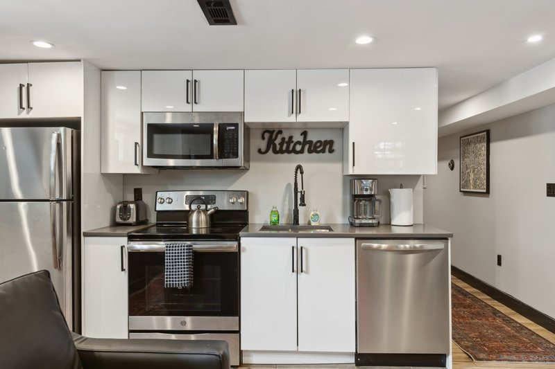 Full kitchen with stainless appliances and dishwasher
